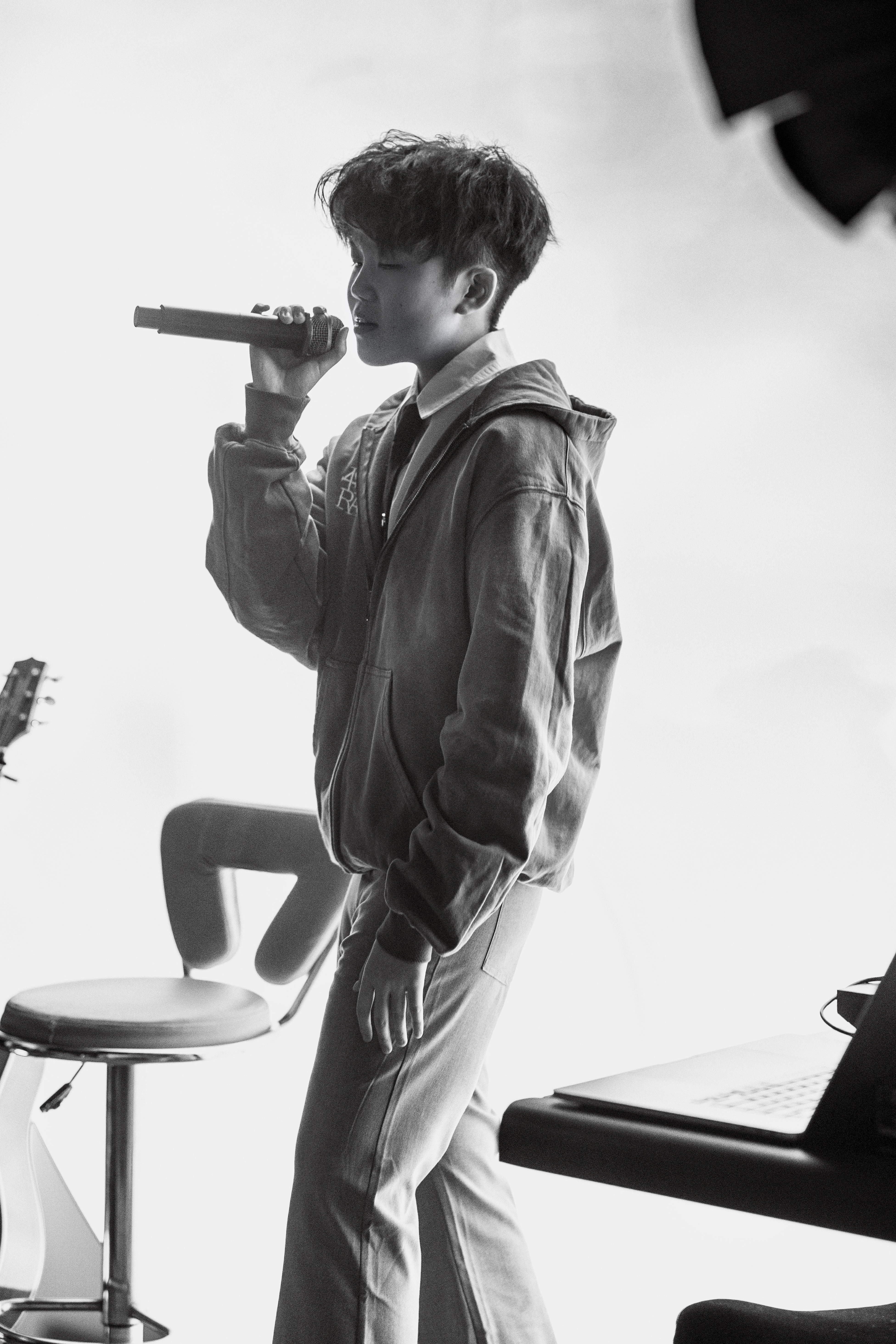 Jen Zou laughing on stage with band